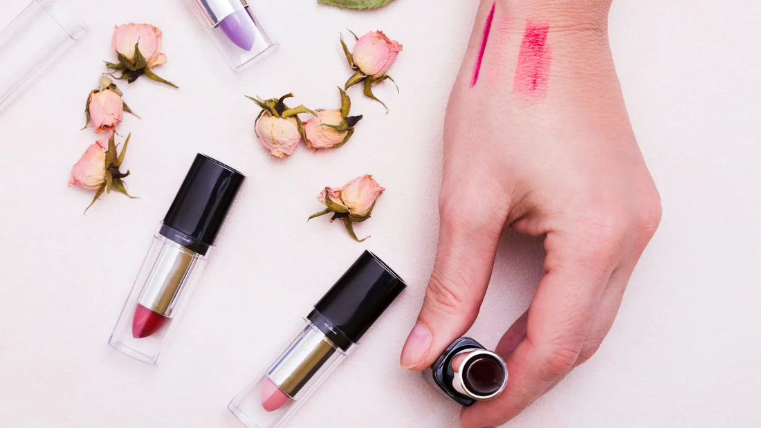 Lipstick swatches and cosmetic products displayed for cosmetic product safety testing and UK & EU cosmetic compliance assessment.