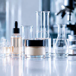 Cosmetic laboratory with beakers and skincare products